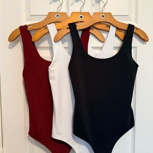 THREE Express Bodysuit’s - Black, White, and Red